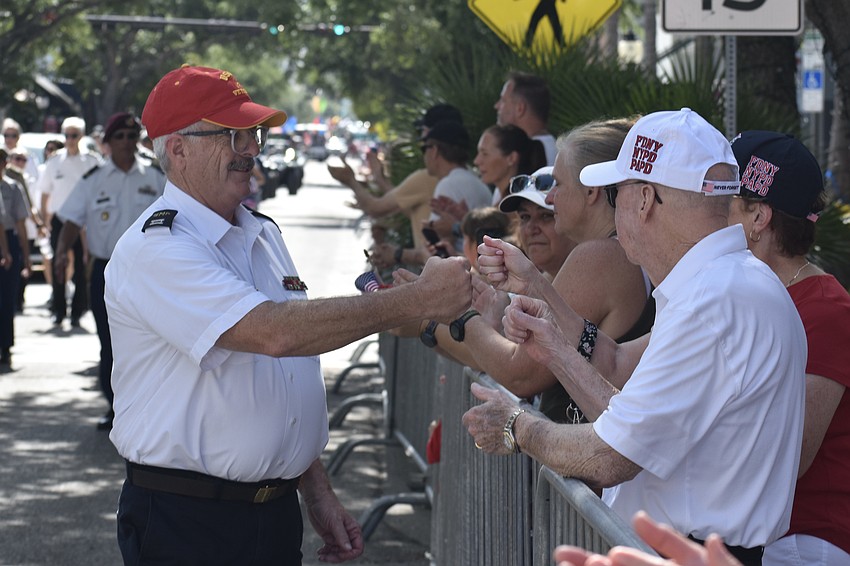 Captain William Edwards of Sarasota Military Academy greets attendees.