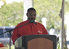 Darrell Butler, the chief veterans service officer with Sarasota County, serves as emcee.