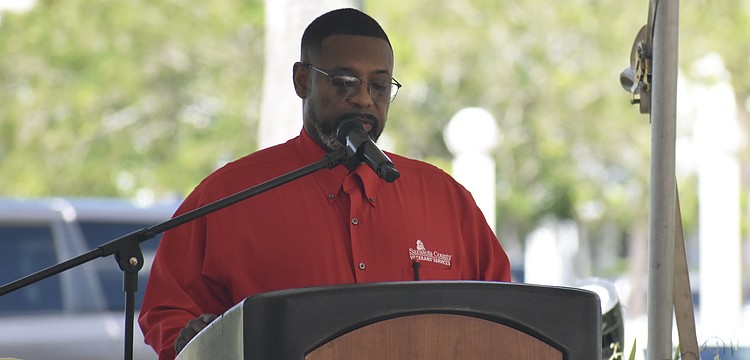 Darrell Butler, the chief veterans service officer with Sarasota County, serves as emcee.