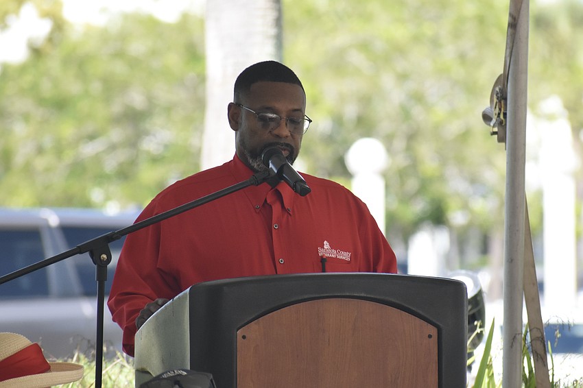 Darrell Butler, the chief veterans service officer with Sarasota County, serves as emcee.