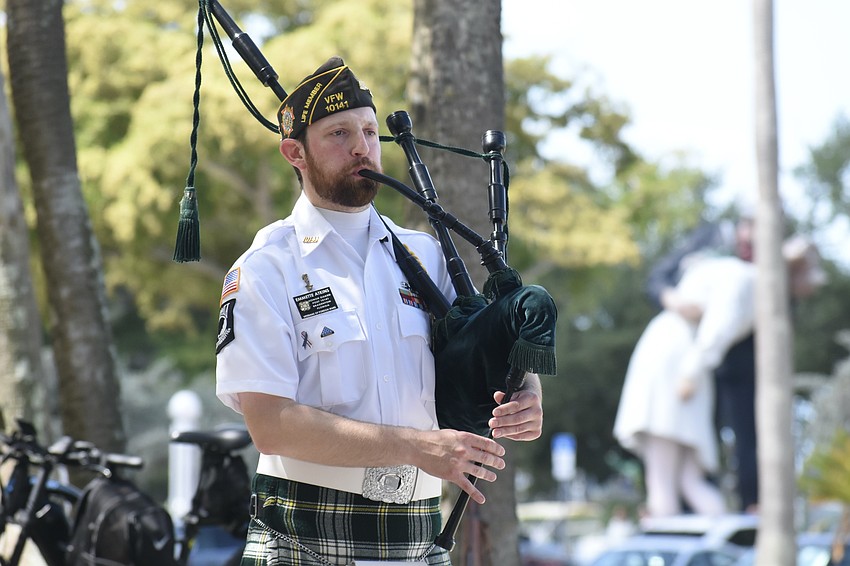 Emmette Atkins plays the bagpipes.