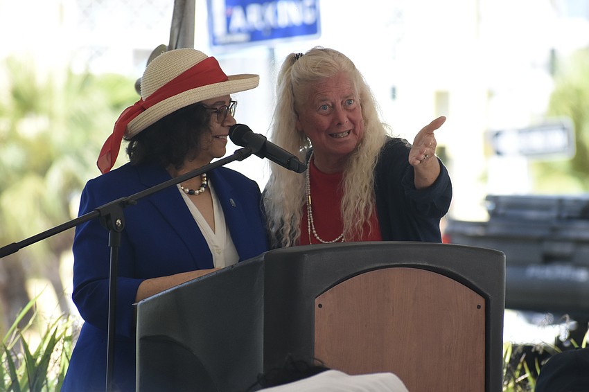 Mayor Debbie Trice and Jan Solomon take to the podium.