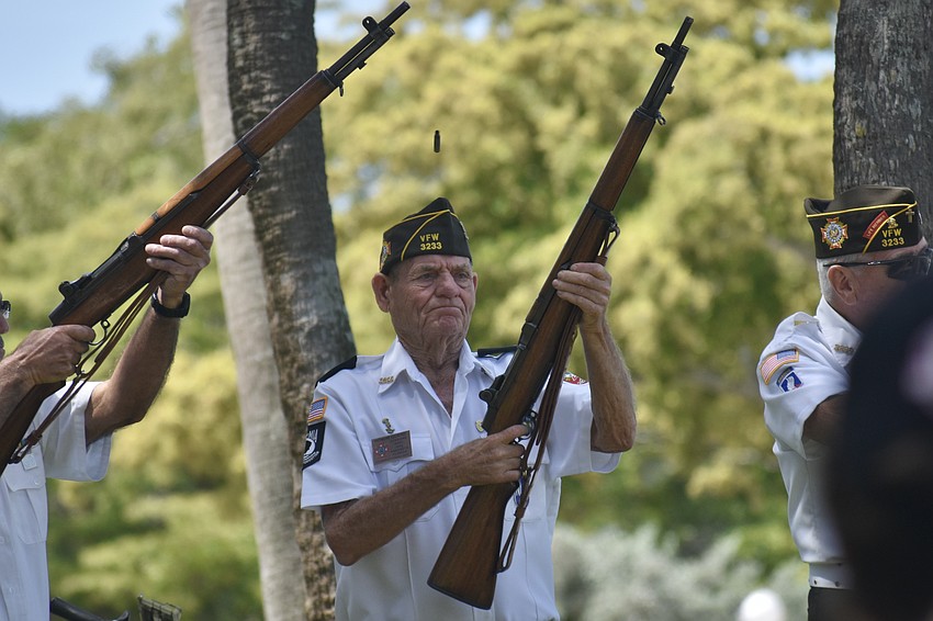 Randy Ragan of VFW Post 3233 participates in a salute.