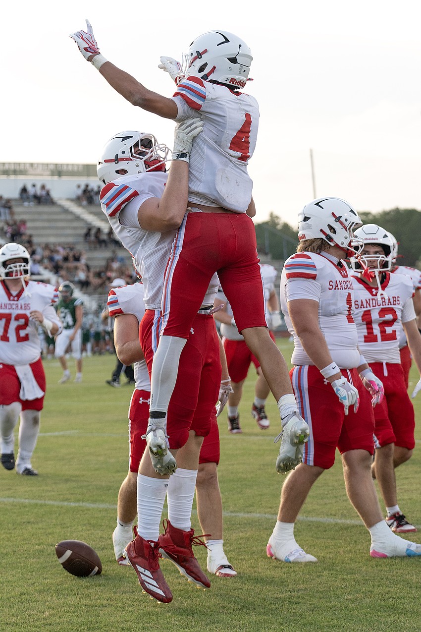 Seabreeze wide receiver Danny Spada (4) celebrates his touchdown with teammate Matt Wells in the spring game, May 22, at Flagler Palm Coast. Photo by Michele Meyers Seabreeze wide receiver Danny Spada (4) celebrates his touchdown with teammate Matt Wells in the spring game, May 22, at Flagler Palm Coast. Photo by Michele Meyers