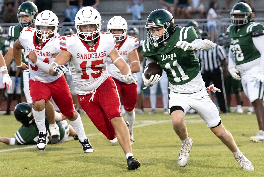 Seabreeze linebacker Cameron Dibernardo (15) pursues FPC's Trace Paffrath (11) in the spring game, May 22, at FPC. Dibernardo transferred from Spruce Creek. Photo by Michele Meyers