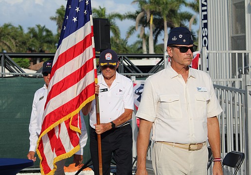 Mark Akerman, Jay Plager and Past Commodore Michael Landis carry away the colors at the conclusion of Bird Key Yacht Club's Memorial Day ceremony on May 25.