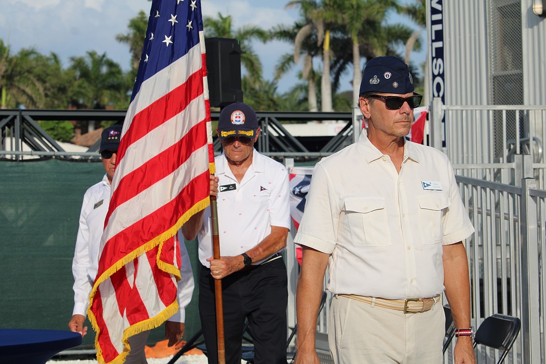 Mark Akerman, Jay Plager and Past Commodore Michael Landis carry away the colors at the conclusion of Bird Key Yacht Club's Memorial Day ceremony on May 25.