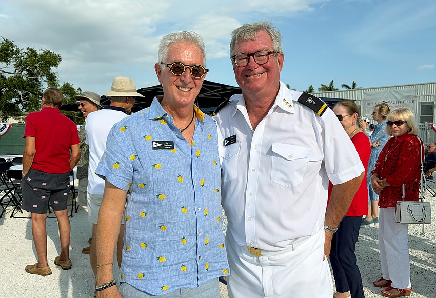 Bird Key Yacht Club Board Secretary Gary Fischman and Commodore Tony Britt chat with guests at the Memorial Day event.