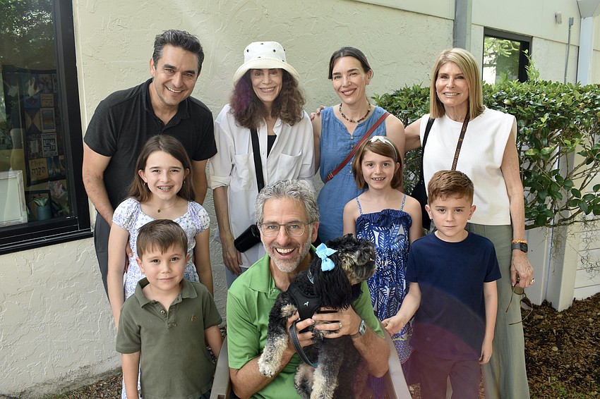 Back row: Andrew Samson, Lauren Fishman, Laura Samson and Susan Samson. Middle row: Daphne Samson, 9, and Cassandra Samson, 7. Front row: Spencer Wyant, 5, Rabbi Brenner Glickman with Tallulah Mae, and Winston Wyant, 7.