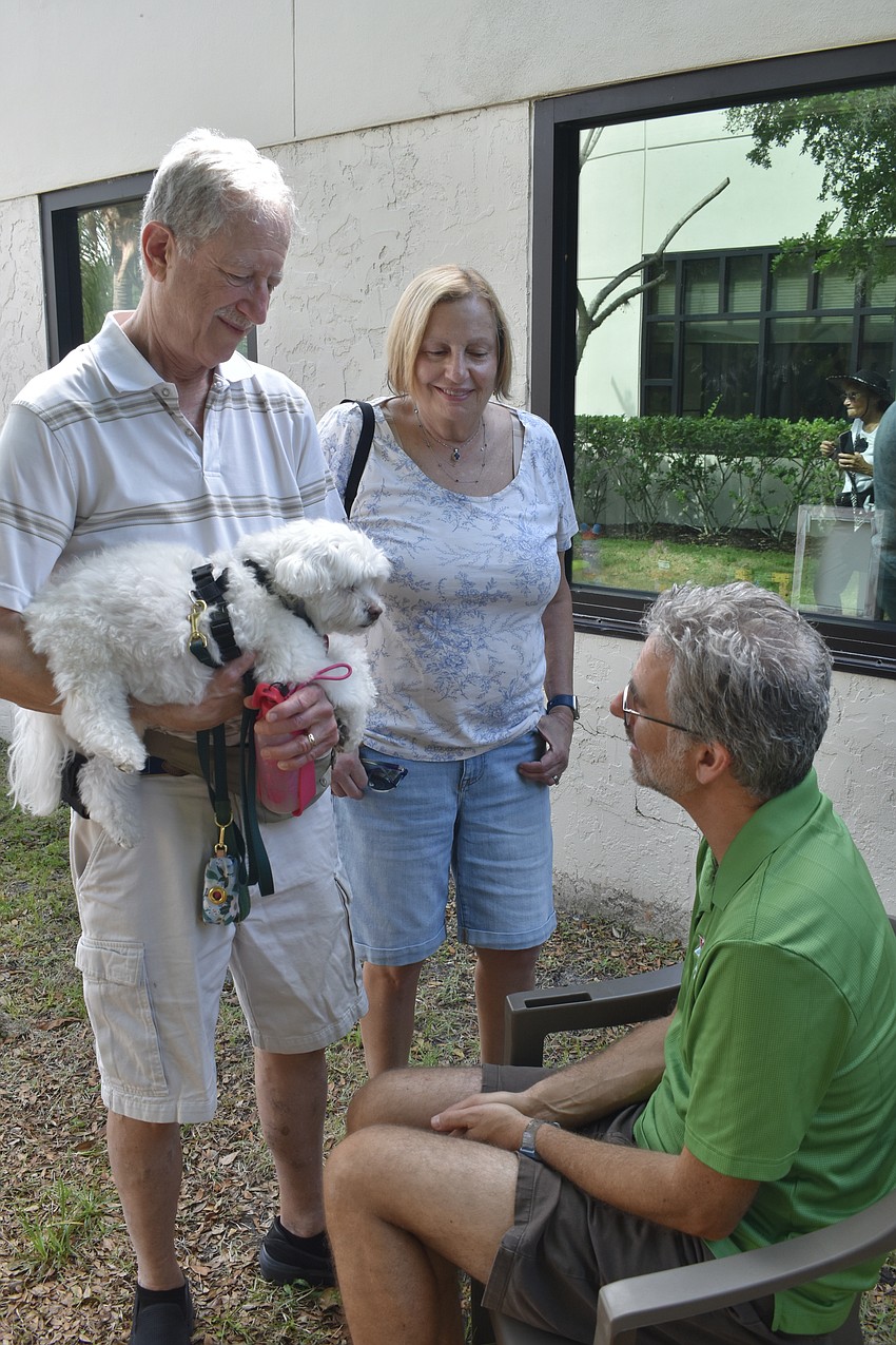 Mark and Carol Granick bring Lacey for a blessing from Rabbi Brenner Glickman.
