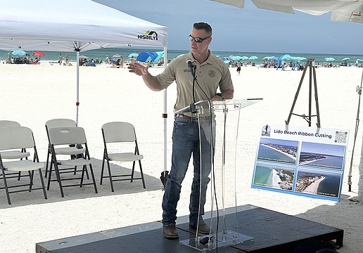 Congressman Greg Steube speaks at the ribbon cutting for the completion of the renourishment project at Lido Beach.