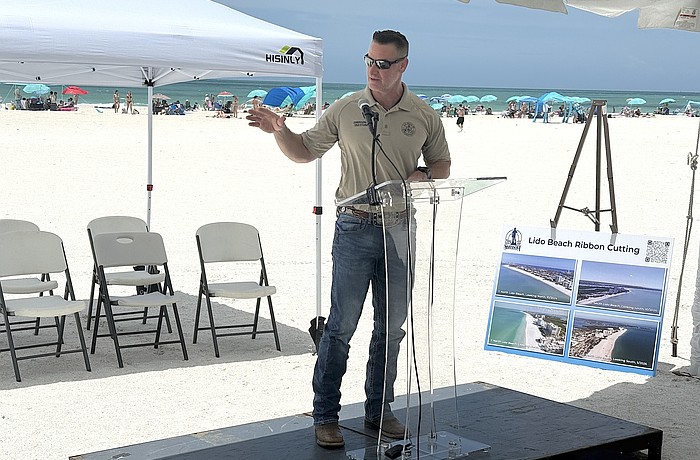 Congressman Greg Steube speaks at the ribbon cutting for the completion of the renourishment project at Lido Beach.