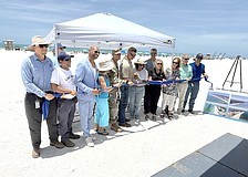 Sarasota Mayor Debbie Trice and Congressman Greg Steube are front and center for the ribbon cutting to mark the completion of Lido Beach renourishment.