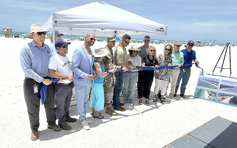 Sarasota Mayor Debbie Trice and Congressman Greg Steube are front and center for the ribbon cutting to mark the completion of Lido Beach renourishment.