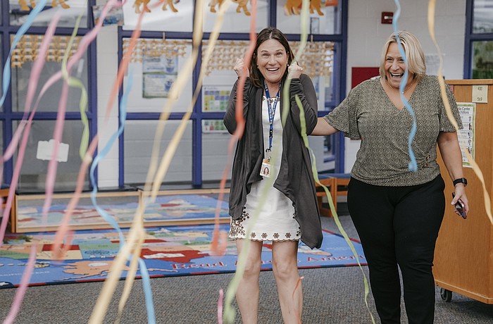 Stacy Lenz, a teacher at Gulf Gate Elementary, was surprised by the honor during a ceremony at school, alongside principal Michelle Miller, who nominated her.