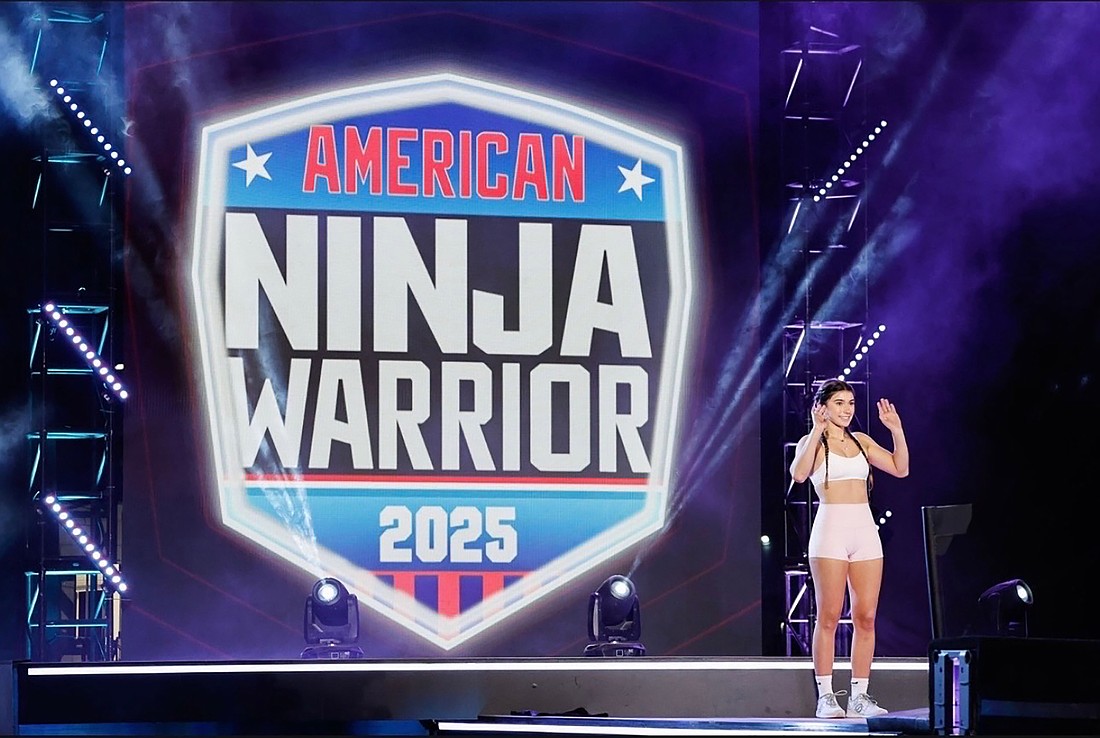 Grace Gordon waved to the crowd before she began the qualifying course on American Ninja Warrior 2025.