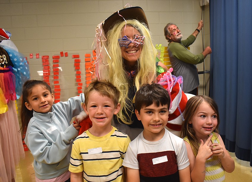Kindergarten students Aliyana Consuegra, Cody Ayers, Lincoln Armstrong and Lyly Cottrell-Billiter are responsible for the outfit worn by Interim Assistant Principal Leslie Jones as part of the Tacky Fashion Show.