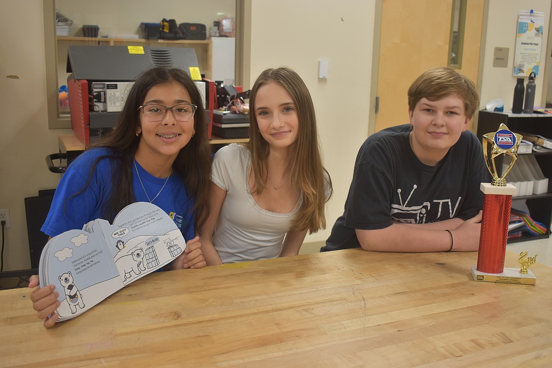 Vittoria Ferrisi Alvarez, Gracie Nichols and Sawyer Nowicki, all seventh graders at Dr. Mona Jain Middle School, created the book called "Snowball's Iceberg Incident" to compete in the Children's Stories event for Technology Student Association.