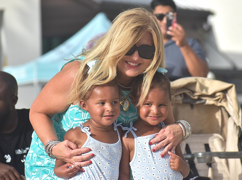 Lisa Beckett is happy to dance with her granddaughters, 2-year-old twins Noah and Navy Clerfond, at Ranch Nite Wednesday May 27.