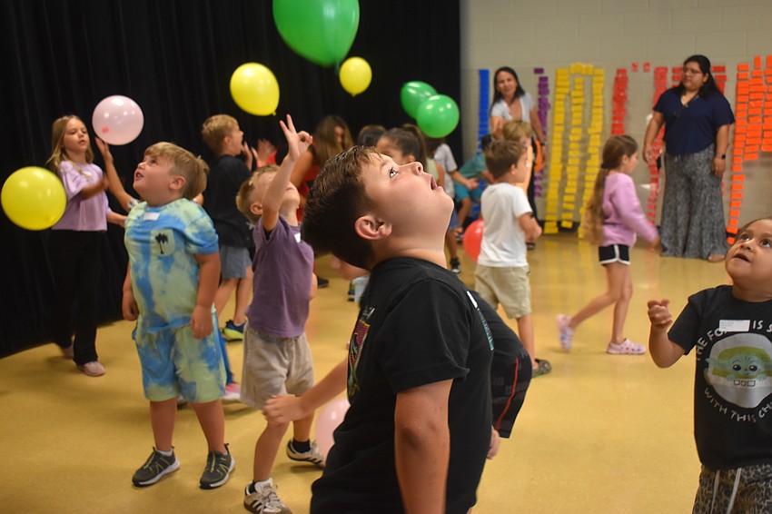 Kindergartener Bryndle Anderson says keeping the balloons in the air for the Balloon Bump Dance Party was quite easy and he appreciates the different colors of the balloons.