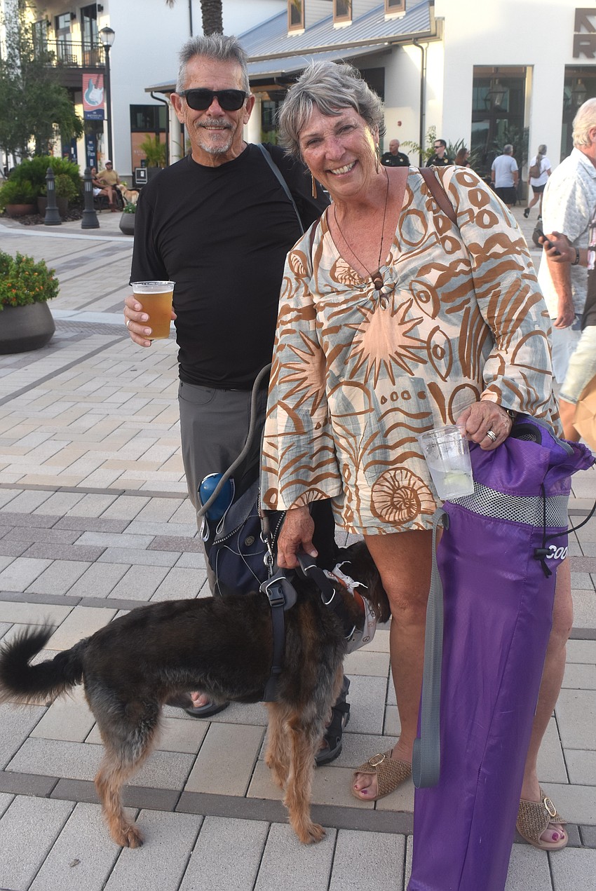 Sarasota's Scott Sellmer and Phyllis Overton, along with their dog, Finn, are glad to attend Ranch Nite Wednesdays, especially to hear the tunes of the Bri Rivera Band.