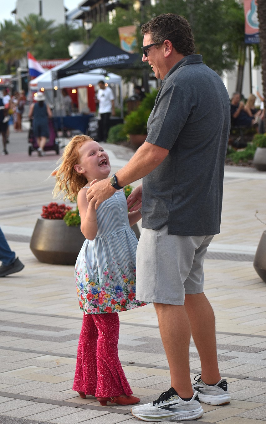 Star Farms' Bell Geisler, 6, and her dad, Tim Geisler, dance the night away to the music of the Bri Rivera Band at Ranch Nite Wednesdays May 27.