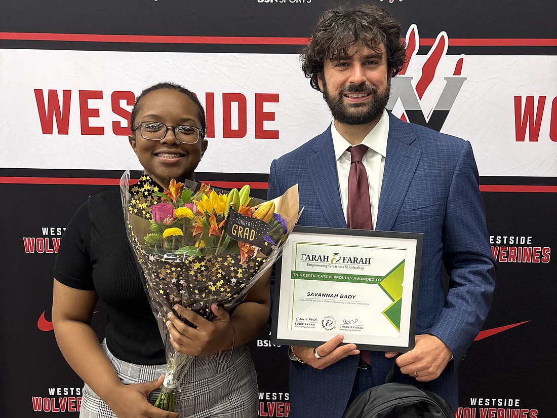 Westside High School senior Savannah Bady, recipient of an Empowering Greatness scholartship, and attorney Khalil Farah.