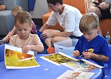 Lakewood Ranch's Cole Mule and Bodie Hogan, both 3 years old, explore the bee-themed magnet activity.