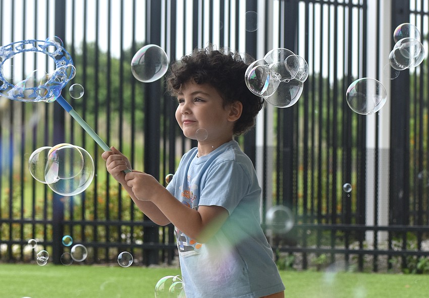 Parrish's Nathan Melendez, 4, says his favorite part of the Summer Learning Program Kickoff Party is the bubble station and the foam building blocks.