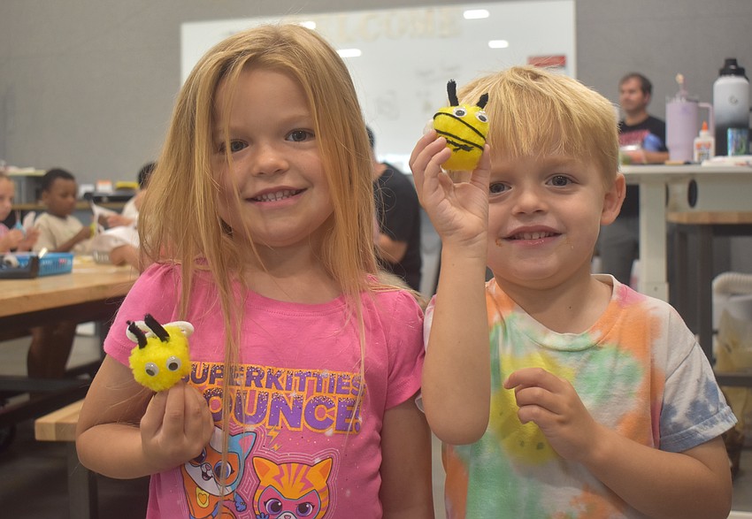Parrish's Blayke Baumgartner, 5, and Asher Baumgartner, 4, show off the bees they created.