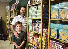 Silas and Josh Stacy stand amid their collection.