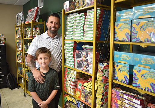 Silas and Josh Stacy stand amid their collection.