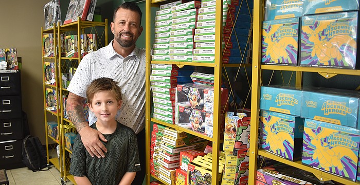 Silas and Josh Stacy stand amid their collection.