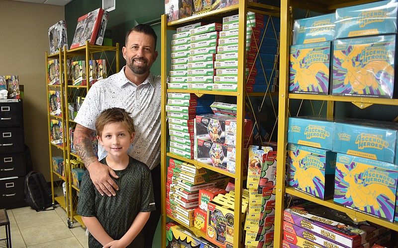 Silas and Josh Stacy stand amid their collection.