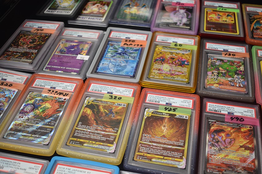 Cards sit in a display case.