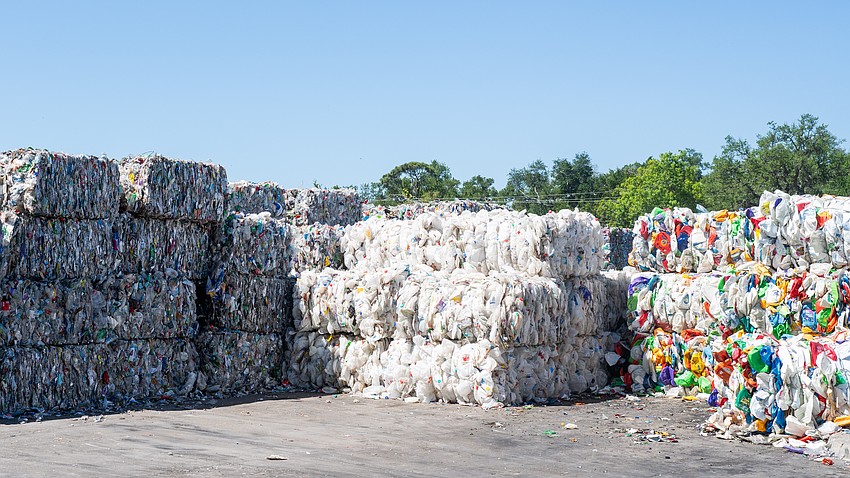 Plastics are separated and baled at the Circular Services materials recovery facility. Polyurethane (PET) can be seen to the left, with uncolored and colored high-density polyethylene (HDPE) to the middle and right. The recovered plastic is sold by the truckload to manufacturers who repurpose the plastic into a new product.