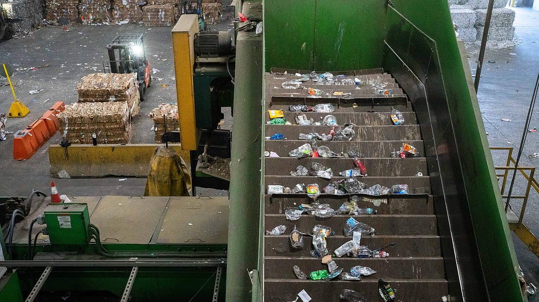 Plastic bottles have been separated from other recyclables as they travel along a conveyor line at the Circular Services materials recovery facility in Sarasota.
