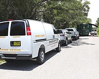 Sarasota County Sheriff's Office mobile crime units set up shop on Leonard Reid Avenue following the discovery of partial human skeletal remains on Friday, May 29.