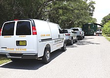 Sarasota County Sheriff's Office mobile crime units set up shop on Leonard Reid Avenue following the discovery of partial human skeletal remains on Friday, May 29.