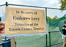 Longboat Key Tennis Center members and friends of Dolores Levy honored her memory with the unveiling of a new plaque at the center last weekend.