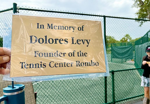 Longboat Key Tennis Center members and friends of Dolores Levy honored her memory with the unveiling of a new plaque at the center last weekend.