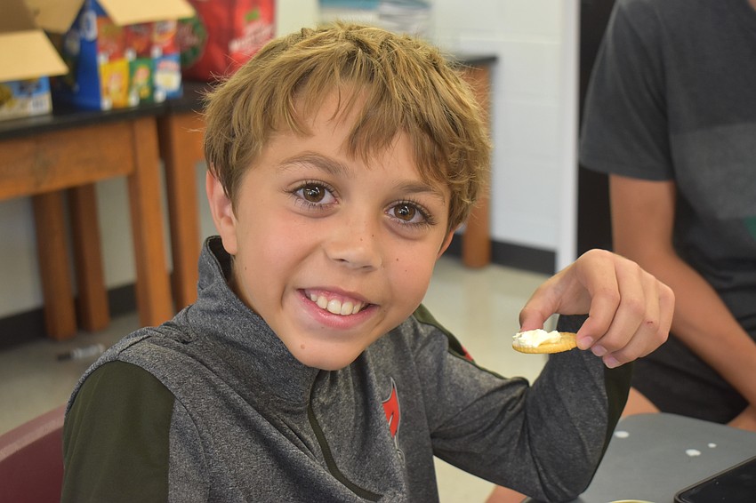 Bradenton's Mateo Bellantonio, 10, says making butter is his favorite because it is yummy.