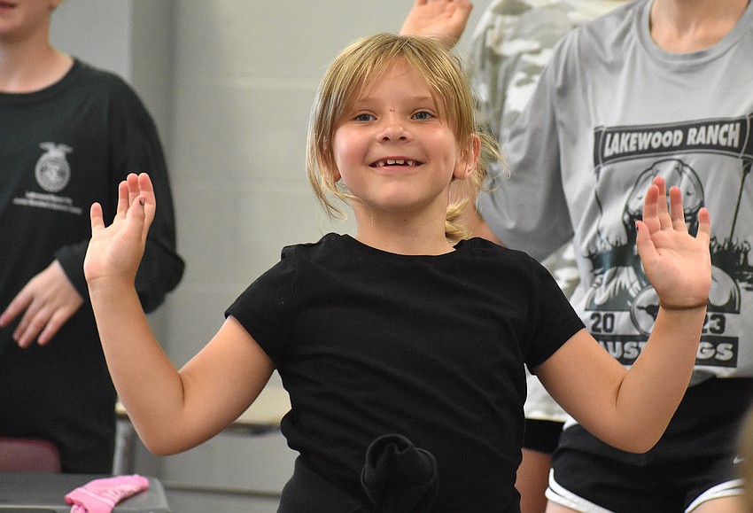 Lakewood Ranch's Charlotte Wort, 7, says she had fun dancing, making butter and squeezing milk out of the cow.