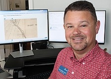 Sarasota History Center Manager Josh Goodman is an avid historian who loves checking out maps of the region in the 1700s.