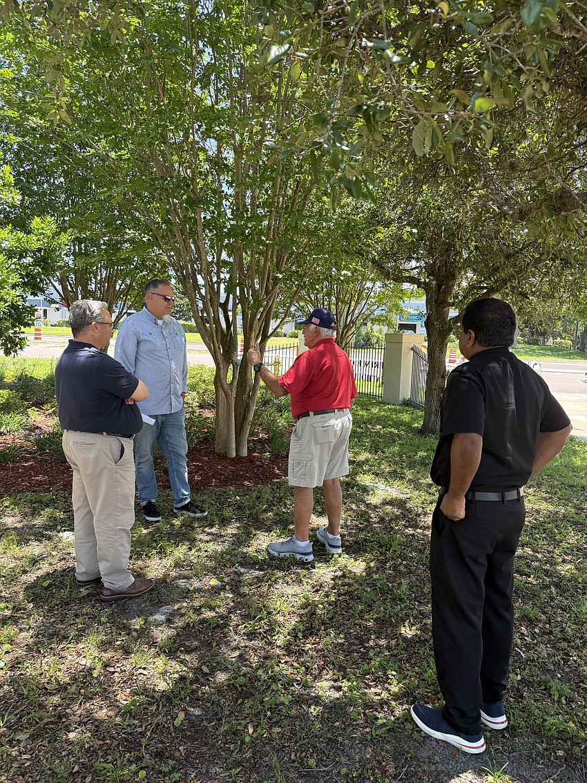 County Engineer Tadd Kasbeer meets with parishioner John Malafronte (center), Assistant City Manager Shawn Finley (left) and Rev. Justin Vakko (right). Courtesy photo