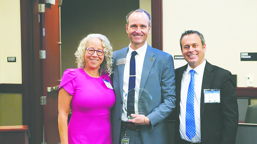 Duval County Judge Robin Lanigan, former Jacksonville Area Legal Aid Pro Bono Director Aaron Irving and Duval County Judge James Nealis.