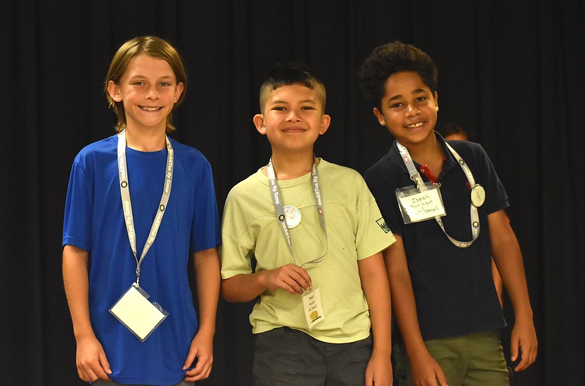 Braden River Elementary's Tyler Shomo, Freedom Elementary's Henry Michaels and Tillman Elementary's Isaiah Dunbar, who are all rising fourth graders, take a brief break from dancing.