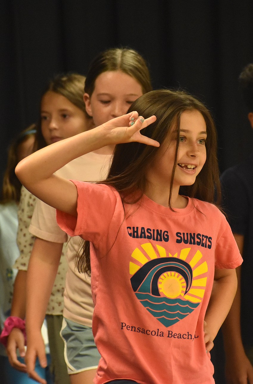 Tinsley Heston, a rising third grader at Braden River Elementary, strikes a pose at the end of the dance class warmup.