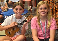 Isabella Cz, a rising sixth grader at Dr. Mona Jain Middle School, and Skylar Flandreau, a rising sixth grader at Martha B. King Middle School, take turns playing the ukulele during the Manatee Arts Education Council smARTen Up Camp.