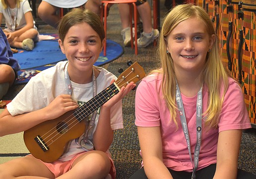 Isabella Cz, a rising sixth grader at Dr. Mona Jain Middle School, and Skylar Flandreau, a rising sixth grader at Martha B. King Middle School, take turns playing the ukulele during the Manatee Arts Education Council smARTen Up Camp.